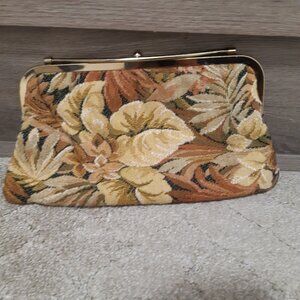 Cloth leaf scene clutch bag with cross over bar closure